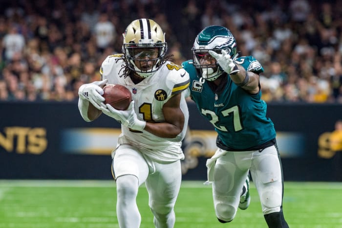 New Orleans Saints running back Alvin Kamara (41) runs the ball against Eagles safety Malcolm Jenkins (27). Mandatory Credit: Scott Clause/The Advertiser via USA TODAY NETWORK